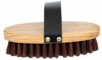 Cowboy brush. stiff bristles on an oval base with hand strap