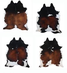 LG/XL Brazilian Tri-Colored hair on cowhide rug. Measures approx. 42.5 - 50 square feet