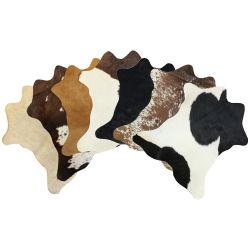 Mini Brazilian hair on cowhide rug. Measures approx. 7-9 square feet